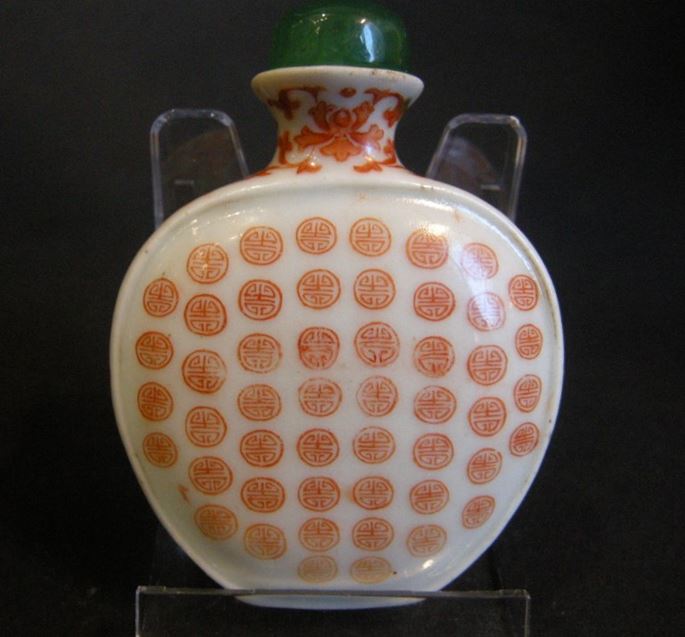 Snuff bottle porcelain ecusson shape decorated in iron red  with hundred shou (longevity)-Imperial workshop Mark Qianlong | MasterArt